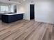 Open concept living space with wood flooring and modern finishes throughout at 1455 S Tennyson St, Denver, CO 80219