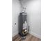 Efficient utility room featuring a modern water heater and neutral color scheme at 1455 S Tennyson St, Denver, CO 80219