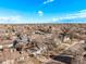 Wide aerial shot of a residential area, showcasing well-spaced homes and mature trees at 2268 S Laredo St, Aurora, CO 80013