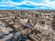 Overhead neighborhood view with homes, mature trees, and blue sky with scattered clouds in background at 2268 S Laredo St, Aurora, CO 80013
