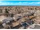 Neighborhood aerial view with mature trees and houses; blue sky with scattered clouds and mountains in background at 2268 S Laredo St, Aurora, CO 80013
