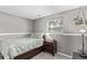 Comfortable bedroom features a window, neutral color scheme, and side table at 2268 S Laredo St, Aurora, CO 80013
