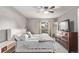 Cozy bedroom featuring a large bed, ceiling fan, and natural lighting at 2268 S Laredo St, Aurora, CO 80013