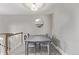 Charming dining area with modern light fixture and stairway to the left at 2268 S Laredo St, Aurora, CO 80013
