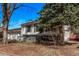 A charming home with mature trees shading a well-maintained front yard and sidewalk at 2268 S Laredo St, Aurora, CO 80013