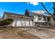 Charming home with an attached garage, white siding, and a well-maintained front yard at 2268 S Laredo St, Aurora, CO 80013