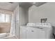 Convenient laundry area featuring a washing machine and a shower area at 2268 S Laredo St, Aurora, CO 80013