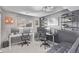 Spacious home office with three computer setups, shelving, and comfortable seating at 2268 S Laredo St, Aurora, CO 80013