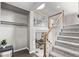 Stairway with white railings and wooden posts leading to the upper level at 2268 S Laredo St, Aurora, CO 80013