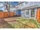 Backyard features a fenced-in lawn and a patio area, perfect for outdoor dining and entertaining at 8312 S Saulsbury St # C, Littleton, CO 80128