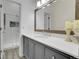 Bathroom features a modern vanity with a framed mirror and a glass-enclosed shower at 8312 S Saulsbury St # C, Littleton, CO 80128