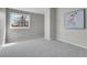 This empty bedroom offers soft carpet, natural light, and a blank canvas for design at 8312 S Saulsbury St # C, Littleton, CO 80128