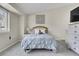 Cozy bedroom features neutral tones, soft carpet, and a large window for natural light at 8312 S Saulsbury St # C, Littleton, CO 80128