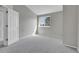This empty bedroom offers soft carpet, natural light, and a blank canvas for design at 8312 S Saulsbury St # C, Littleton, CO 80128