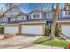Charming townhome featuring a two-car garage, stone accents, and a well-maintained front yard in a desirable community at 8312 S Saulsbury St # C, Littleton, CO 80128