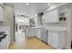 Well-appointed kitchen with stainless steel appliances, white cabinetry, and hardwood floors at 8312 S Saulsbury St # C, Littleton, CO 80128