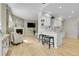 Bright, open-concept space featuring a fireplace, adjacent to the kitchen area at 8312 S Saulsbury St # C, Littleton, CO 80128