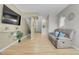 Spacious living area with light hardwood floors, comfortable seating, and ample natural light at 8312 S Saulsbury St # C, Littleton, CO 80128