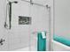 Contemporary shower features glass enclosure, white tile, and a mosaic-tile detail at 8312 S Saulsbury St # C, Littleton, CO 80128
