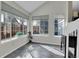 Bright sun room with large windows for natural light and slate flooring at 8312 S Saulsbury St # C, Littleton, CO 80128