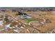 Aerial view of community pool, playground, and clubhouse in residential development at 3014 Furthermore Ln, Castle Rock, CO 80108