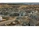 Aerial view of a residential neighborhood with fenced yards and mountain views at 3014 Furthermore Ln, Castle Rock, CO 80108