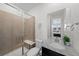 Bathroom featuring tiled shower, vanity with granite countertop, and decorative mirror at 3014 Furthermore Ln, Castle Rock, CO 80108