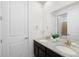 Bathroom featuring double sinks with granite countertop, and a large mirror at 3014 Furthermore Ln, Castle Rock, CO 80108