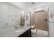 Well-lit bathroom with a tiled shower, granite countertop, and decorative accents at 3014 Furthermore Ln, Castle Rock, CO 80108