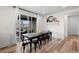 Elegant dining area with a long table and chairs, complemented by sliding glass doors at 3014 Furthermore Ln, Castle Rock, CO 80108