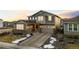 Charming two-story home with three-car garage and beautiful sunset sky at 3014 Furthermore Ln, Castle Rock, CO 80108