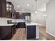 Modern kitchen with a center island, stainless steel appliances, and ample counter space at 9269 Garnett St # C, Arvada, CO 80007