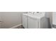 Modern laundry room with white, front-loading LG washer and dryer with light walls and dark base trim at 9269 Garnett St # C, Arvada, CO 80007