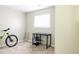 Bright bedroom featuring a study area, a window, and neutral color scheme at 2664 S Grant St, Denver, CO 80210