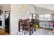 Inviting dining area with seating for four, situated near the living room. Artwork on the wall adds a creative touch to the space at 2664 S Grant St, Denver, CO 80210