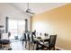 Dining room featuring a ceiling fan, sliding glass doors, and stylish table and chairs at 2664 S Grant St, Denver, CO 80210