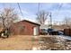 View of detached garage with parking for two cars and extra storage space in back at 2664 S Grant St, Denver, CO 80210