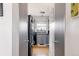 Cozy kitchen with gray cabinets, modern appliances, and a window offering natural light, viewed from a doorway at 2664 S Grant St, Denver, CO 80210