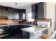 Well-equipped kitchen featuring sleek countertops, cabinets, and stainless steel appliances at 2664 S Grant St, Denver, CO 80210