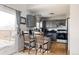 Stylish kitchen featuring gray cabinets, a breakfast bar with seating, and modern appliances. Enjoy culinary adventures in this space at 2664 S Grant St, Denver, CO 80210