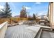 Large backyard deck featuring a fire pit and built-in seating at 1434 Hickory Dr, Erie, CO 80516