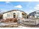 Relaxing backyard deck with fire pit and covered patio area at 1434 Hickory Dr, Erie, CO 80516