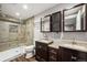 Basement bathroom with double sinks and shower at 1434 Hickory Dr, Erie, CO 80516