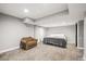 Finished basement bedroom with plush carpet and ample natural light at 1434 Hickory Dr, Erie, CO 80516