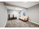 Finished basement area with a futon at 1434 Hickory Dr, Erie, CO 80516