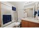 Clean bathroom with shower/tub combo and wood vanity at 1434 Hickory Dr, Erie, CO 80516