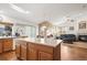 Kitchen with island, hardwood floors, and plenty of cabinet space at 1434 Hickory Dr, Erie, CO 80516