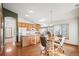 Eat-in kitchen with wood cabinetry and a breakfast nook at 1434 Hickory Dr, Erie, CO 80516