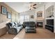 Spacious living room with fireplace and ample natural light at 1434 Hickory Dr, Erie, CO 80516