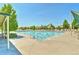 Community pool with ample deck space and shaded seating areas at 1434 Hickory Dr, Erie, CO 80516